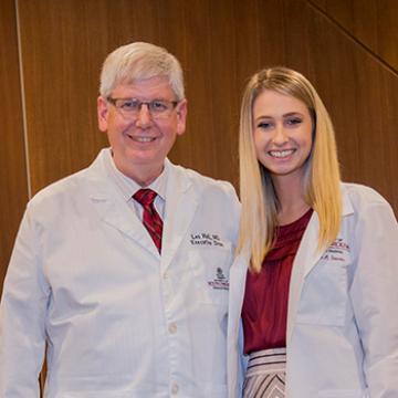 Second-year student Kylie Stevens (pictured with School of Medicine dean Les Hall) is a recipient of the Rural Health Student Recruitment Loan, which encourages health profession students to pursue rural practice.  