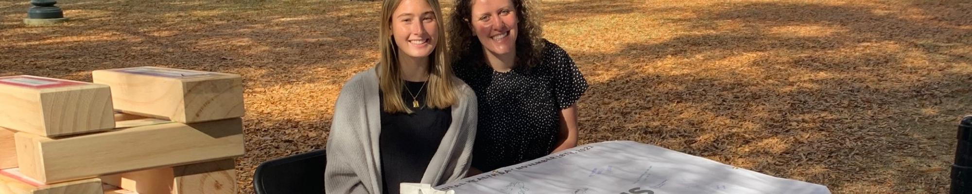 Two rural interest group students at a CRPH table for Rural Health Day