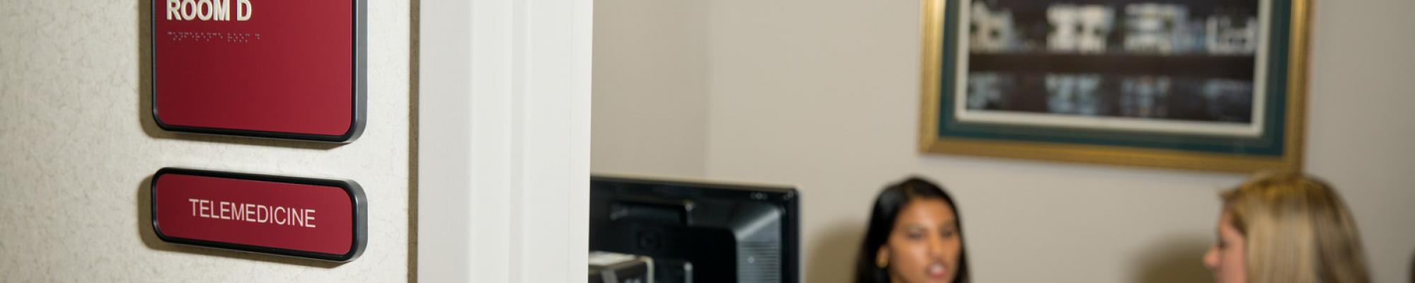 Doctors in a telemedicine room